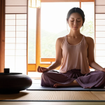 Serene Meditation Scene**

Prompt: A woman meditating peacefully in a sunlit room, eyes closed, gentle smile. Soft, warm lighting. Aromatherapy diffuser emitting a wisp of fragrant smoke. Focus on tranquility and inner peace. Pastel colors, serene atmosphere. Hints of Japanese aesthetic, such as tatami mats or shoji screens. Emphasis on mindfulness.

**